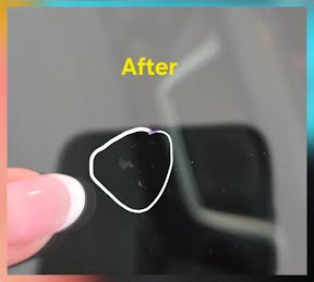 Windshield chip fully repaired, fracture filled and nearly invisible